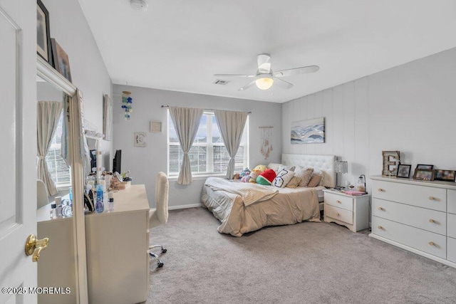 bedroom with light carpet, visible vents, baseboards, and a ceiling fan