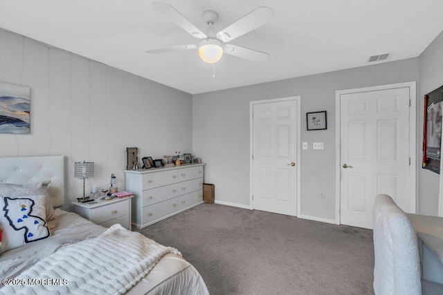 carpeted bedroom featuring visible vents, baseboards, and ceiling fan