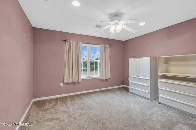 unfurnished bedroom with visible vents, baseboards, and carpet floors