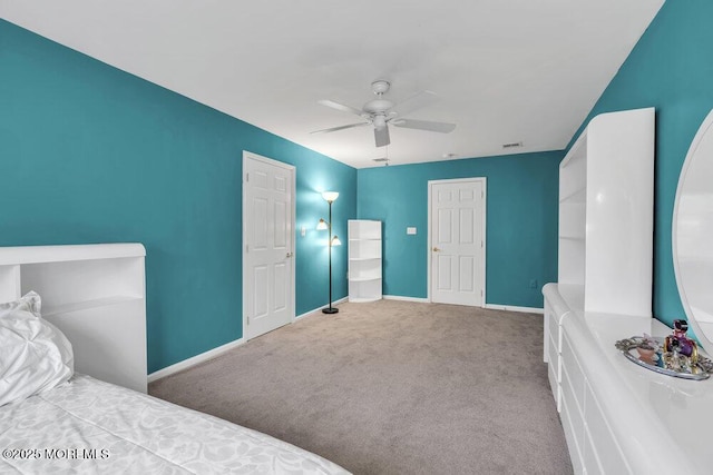 bedroom with carpet floors, baseboards, a ceiling fan, and visible vents