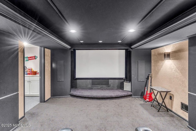 carpeted home theater room featuring recessed lighting, visible vents, and baseboards