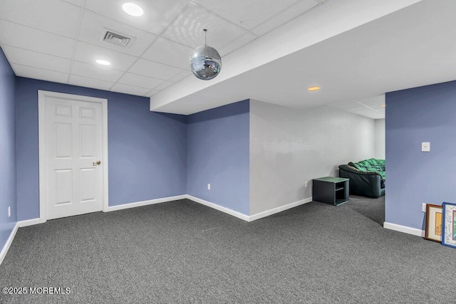 finished below grade area featuring visible vents, baseboards, a paneled ceiling, recessed lighting, and carpet flooring