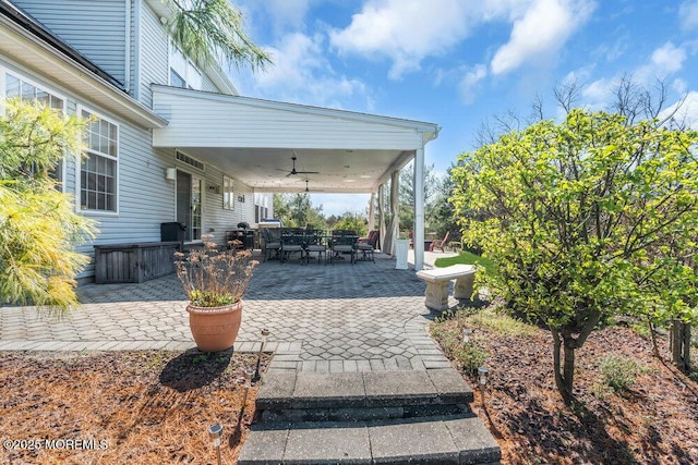 view of patio / terrace featuring outdoor dining area and a ceiling fan