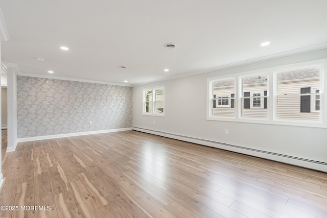 empty room featuring baseboards, ornamental molding, a baseboard radiator, wallpapered walls, and light wood-style flooring