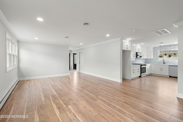 unfurnished living room with light wood finished floors, baseboard heating, visible vents, and ornamental molding