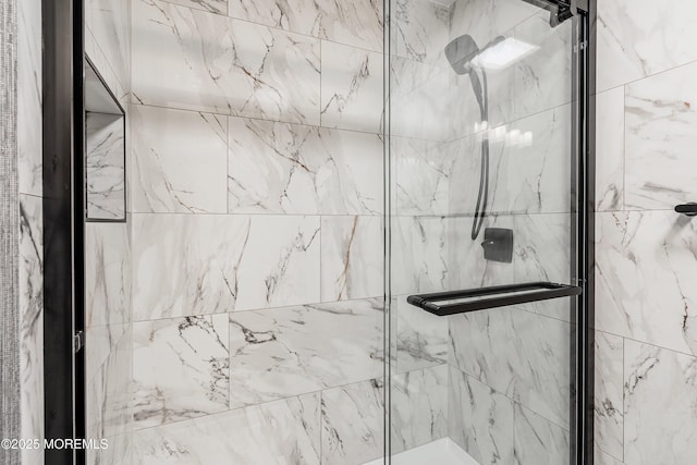 bathroom featuring a shower stall