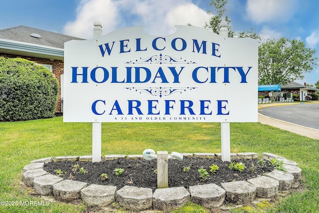 community sign with a lawn