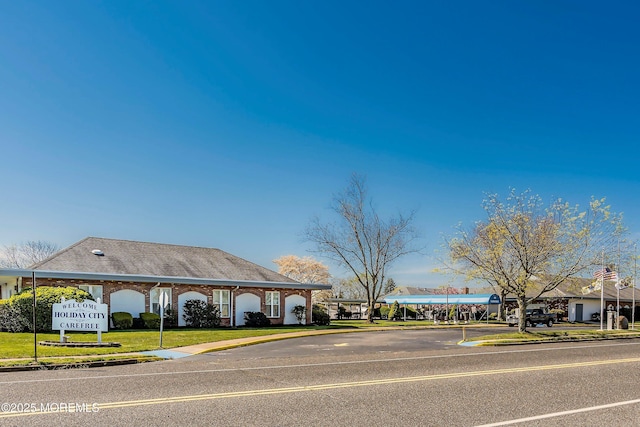 view of street featuring curbs and sidewalks