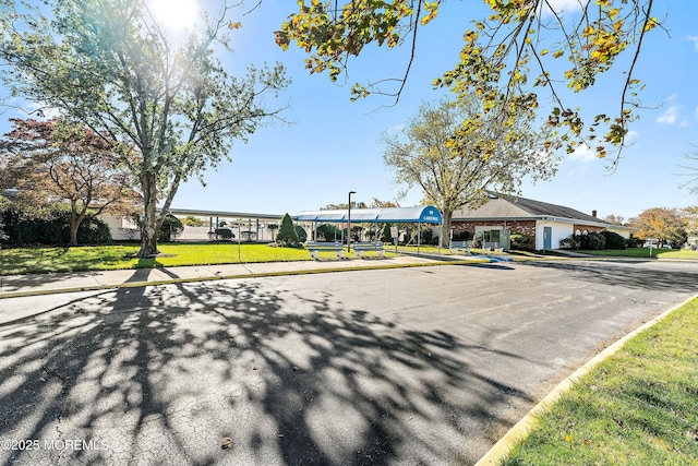 view of street with sidewalks and curbs