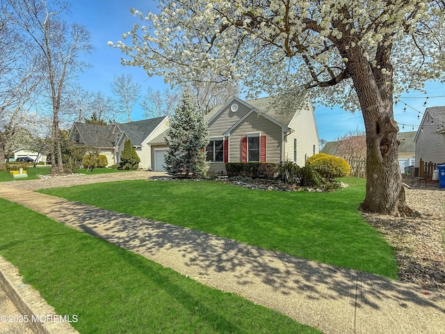 view of front of house with a garage, a front yard, and dirt driveway