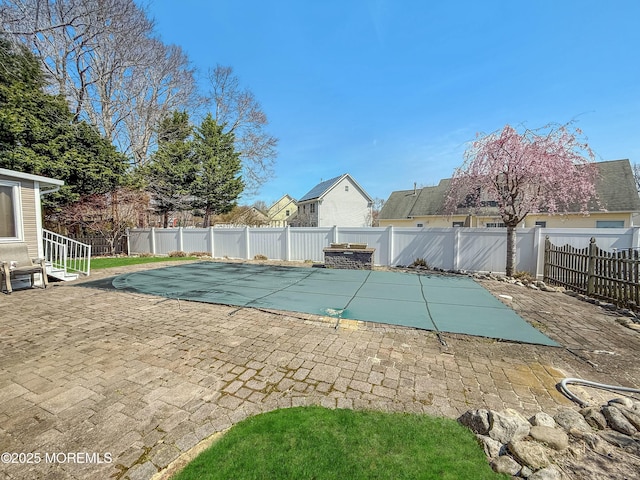 view of pool with a patio area and a fenced backyard