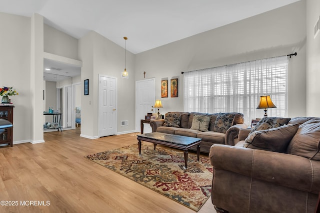 1101B Thornbury Ln, Manchester, NJ 08759 - living room with light wood finished floors, a high ceiling, baseboards, and visible vents