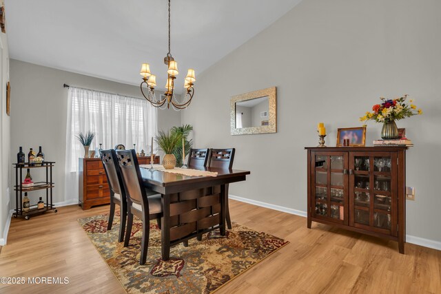 1101B Thornbury Ln, Manchester, NJ 08759 - dining space with a chandelier, light wood-style floors, baseboards, and vaulted ceiling