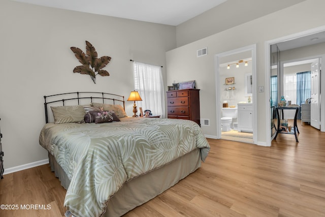 1101B Thornbury Ln, Manchester, NJ 08759 - bedroom with wood finished floors, ensuite bathroom, baseboards, and visible vents
