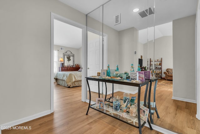 1101B Thornbury Ln, Manchester, NJ 08759 - hallway with visible vents, baseboards, vaulted ceiling, and light wood-style floors