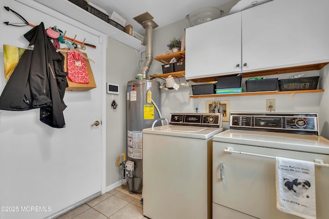 1101B Thornbury Ln, Manchester, NJ 08759 - washroom featuring light tile patterned floors, baseboards, water heater, washer and clothes dryer, and cabinet space
