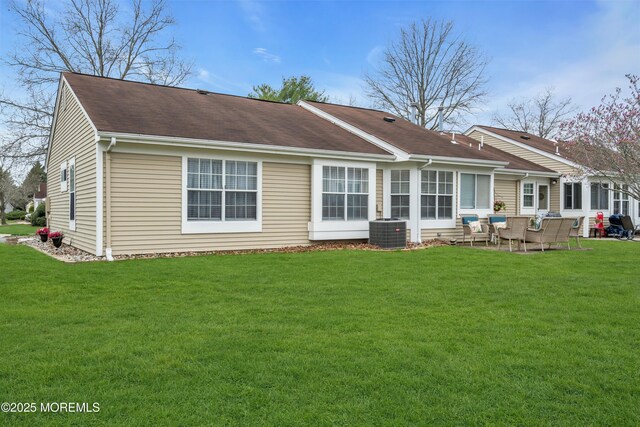 1101B Thornbury Ln, Manchester, NJ 08759 - back of house with central AC, a patio area, and a lawn