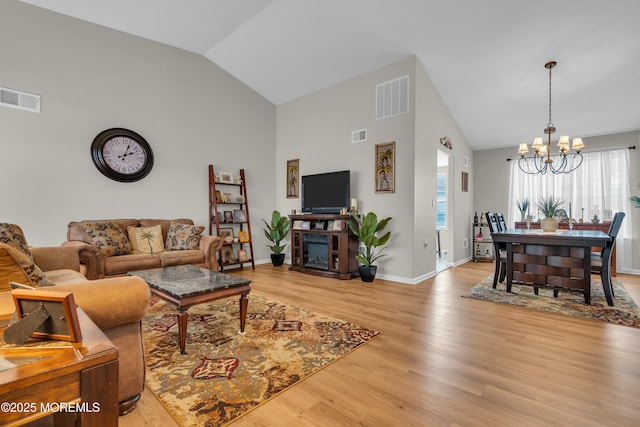 1101B Thornbury Ln, Manchester, NJ 08759 - living area featuring high vaulted ceiling, visible vents, an inviting chandelier, and light wood-style flooring
