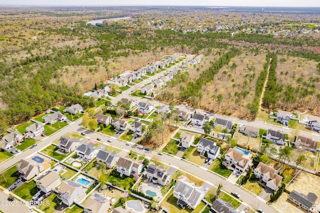 birds eye view of property with a residential view
