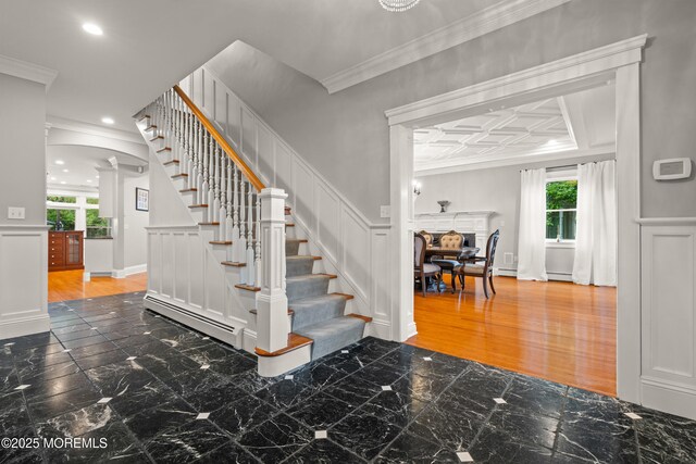 491 Clinton Ave, Toms River, NJ 08753 - staircase with a decorative wall, ornate columns, wainscoting, marble finish flooring, and crown molding