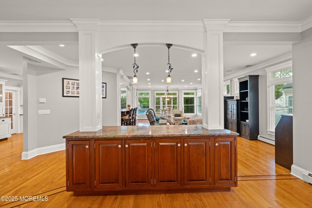 491 Clinton Ave, Toms River, NJ 08753 - kitchen featuring baseboard heating, decorative columns, dark stone counters, recessed lighting, and ornamental molding