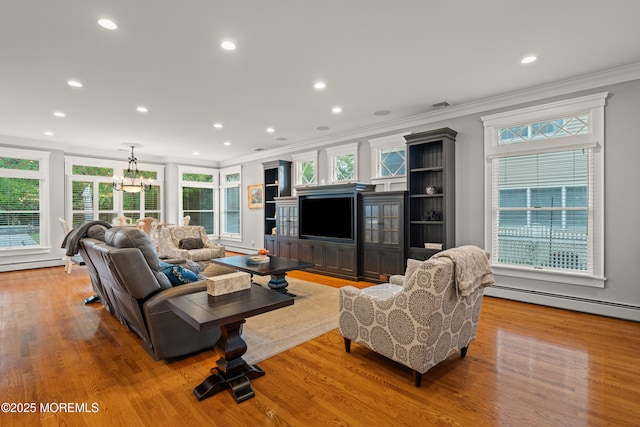 491 Clinton Ave, Toms River, NJ 08753 - living room featuring crown molding, a baseboard radiator, wood finished floors, and recessed lighting