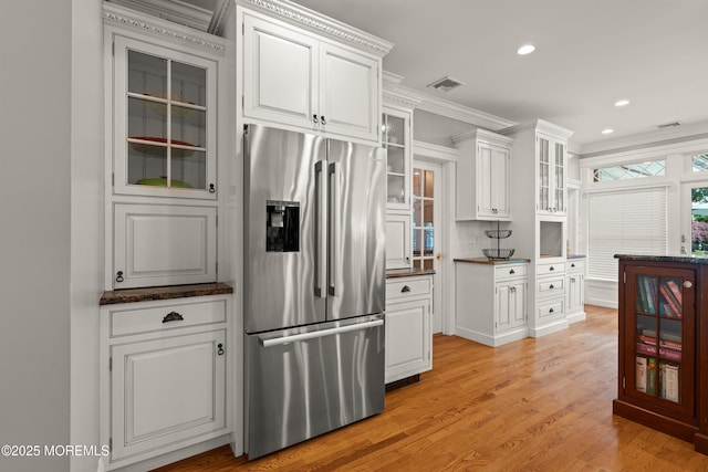 491 Clinton Ave, Toms River, NJ 08753 - kitchen with high end refrigerator, crown molding, glass insert cabinets, light wood finished floors, and white cabinets