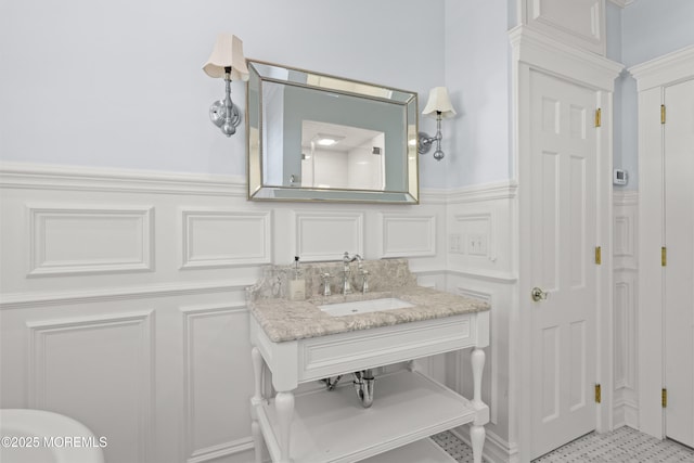 491 Clinton Ave, Toms River, NJ 08753 - bathroom featuring a decorative wall, a wainscoted wall, and vanity