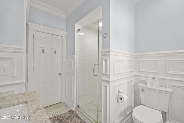 491 Clinton Ave, Toms River, NJ 08753 - bathroom with a shower stall, wainscoting, toilet, a decorative wall, and vanity