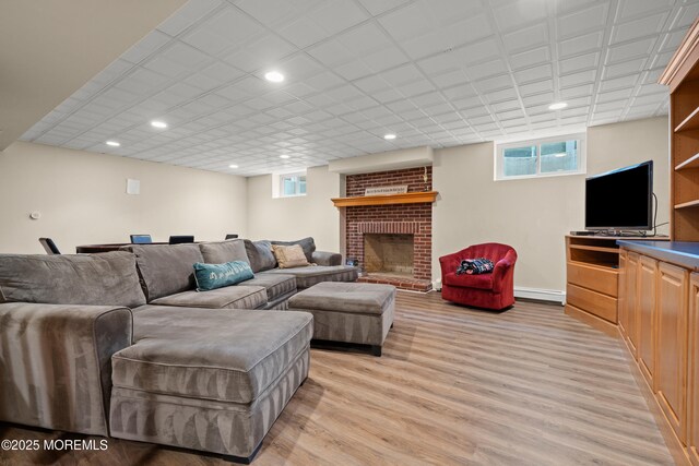 491 Clinton Ave, Toms River, NJ 08753 - living area with light wood-type flooring, recessed lighting, and a fireplace