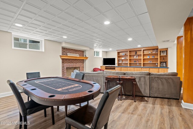 491 Clinton Ave, Toms River, NJ 08753 - playroom with recessed lighting, light wood finished floors, baseboards, and a fireplace