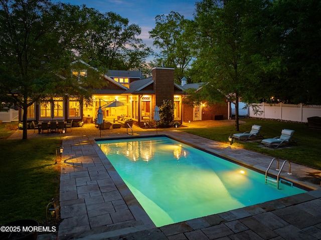 491 Clinton Ave, Toms River, NJ 08753 - pool at dusk featuring a patio area