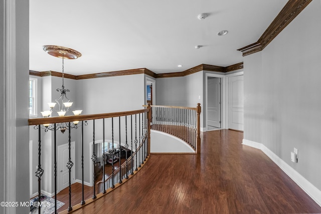 5 Breckenridge Ct, Freehold, NJ 07728 - corridor with an inviting chandelier, wood finished floors, an upstairs landing, baseboards, and ornamental molding