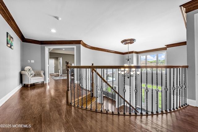 5 Breckenridge Ct, Freehold, NJ 07728 - hall featuring baseboards, an upstairs landing, an inviting chandelier, and crown molding