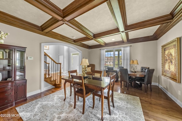 5 Breckenridge Ct, Freehold, NJ 07728 - dining space with stairs, wood finished floors, arched walkways, coffered ceiling, and baseboards