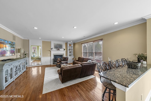 5 Breckenridge Ct, Freehold, NJ 07728 - living area featuring recessed lighting, a warm lit fireplace, and wood finished floors