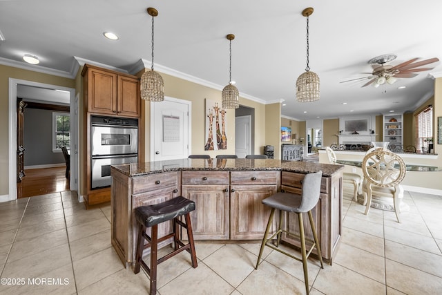 5 Breckenridge Ct, Freehold, NJ 07728 - kitchen featuring a breakfast bar, ornamental molding, baseboards, and double oven