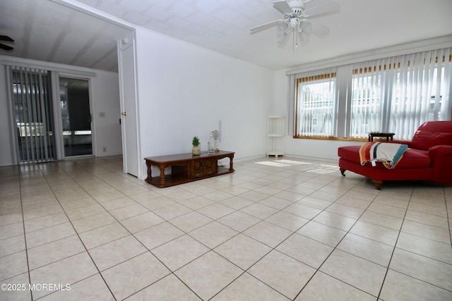 living room with light tile patterned flooring and ceiling fan