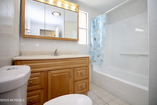 bathroom featuring shower / tub combo, vanity, tile patterned floors, toilet, and tile walls