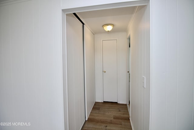 hall featuring crown molding and wood finished floors