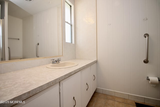 bathroom with tile patterned flooring and vanity