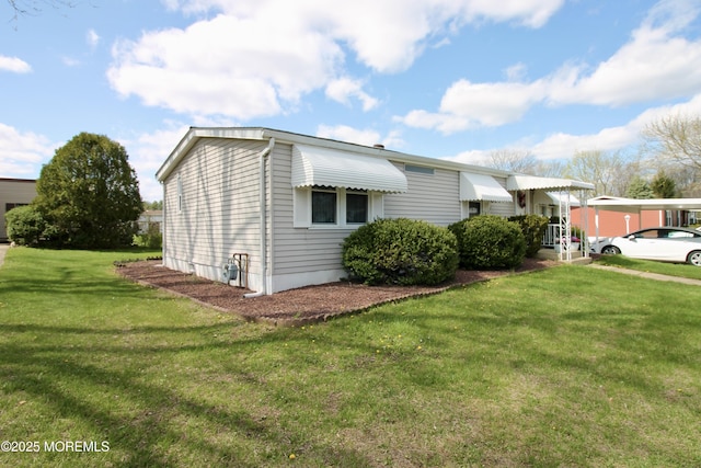 view of home's exterior with a yard