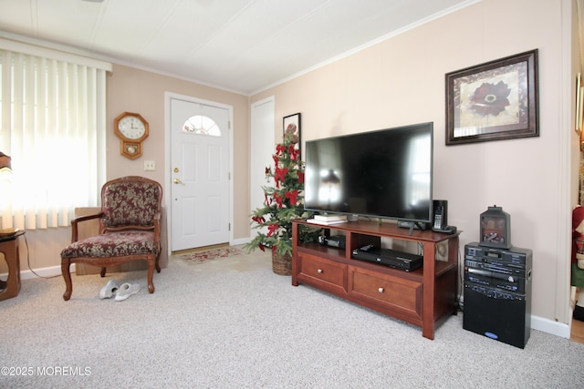 carpeted living room with baseboards and ornamental molding