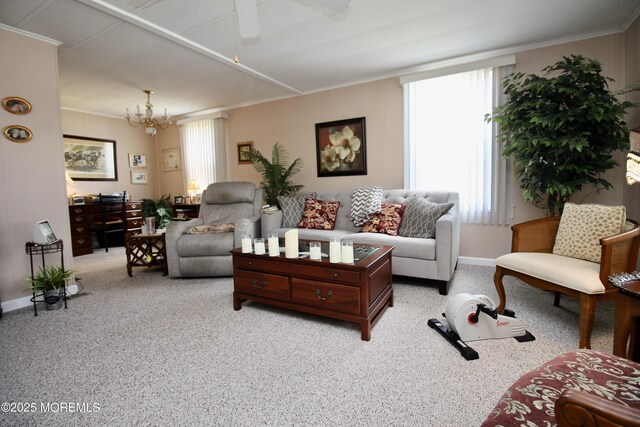 living area featuring light carpet, plenty of natural light, and crown molding