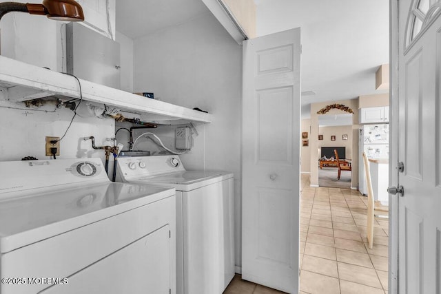 44 Buckingham Dr N, Manchester, NJ 08759 - laundry room with laundry area, separate washer and dryer, and light tile patterned flooring