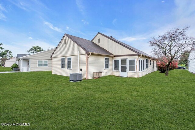 44 Buckingham Dr N, Manchester, NJ 08759 - rear view of property featuring a yard and cooling unit