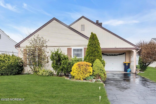 44 Buckingham Dr N, Manchester, NJ 08759 - view of front of home with an attached garage, a chimney, aphalt driveway, and a front yard