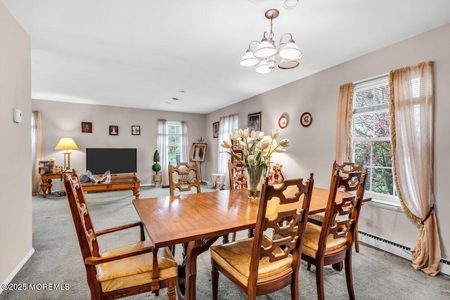 44 Buckingham Dr N, Manchester, NJ 08759 - dining area featuring a chandelier, light colored carpet, baseboards, and baseboard heating