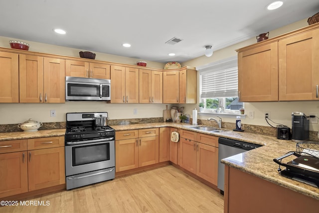 628 Morningside Ave, Union Beach, NJ 07735 - kitchen with stainless steel appliances, a sink, light wood-style floors, light stone countertops, and recessed lighting