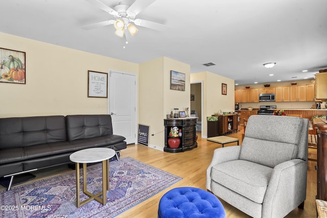 628 Morningside Ave, Union Beach, NJ 07735 - living area featuring a ceiling fan, light wood finished floors, recessed lighting, and baseboards